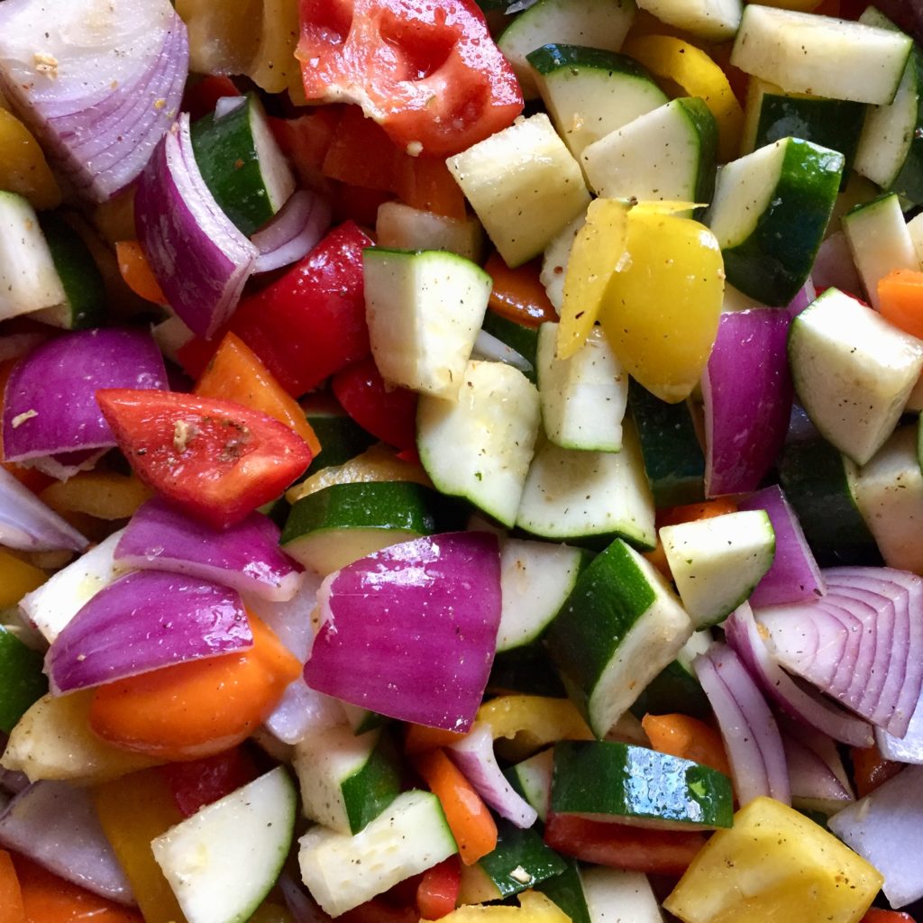 plant-based side dish roasted vegetables onions, tomatoes, peppers, zucchini