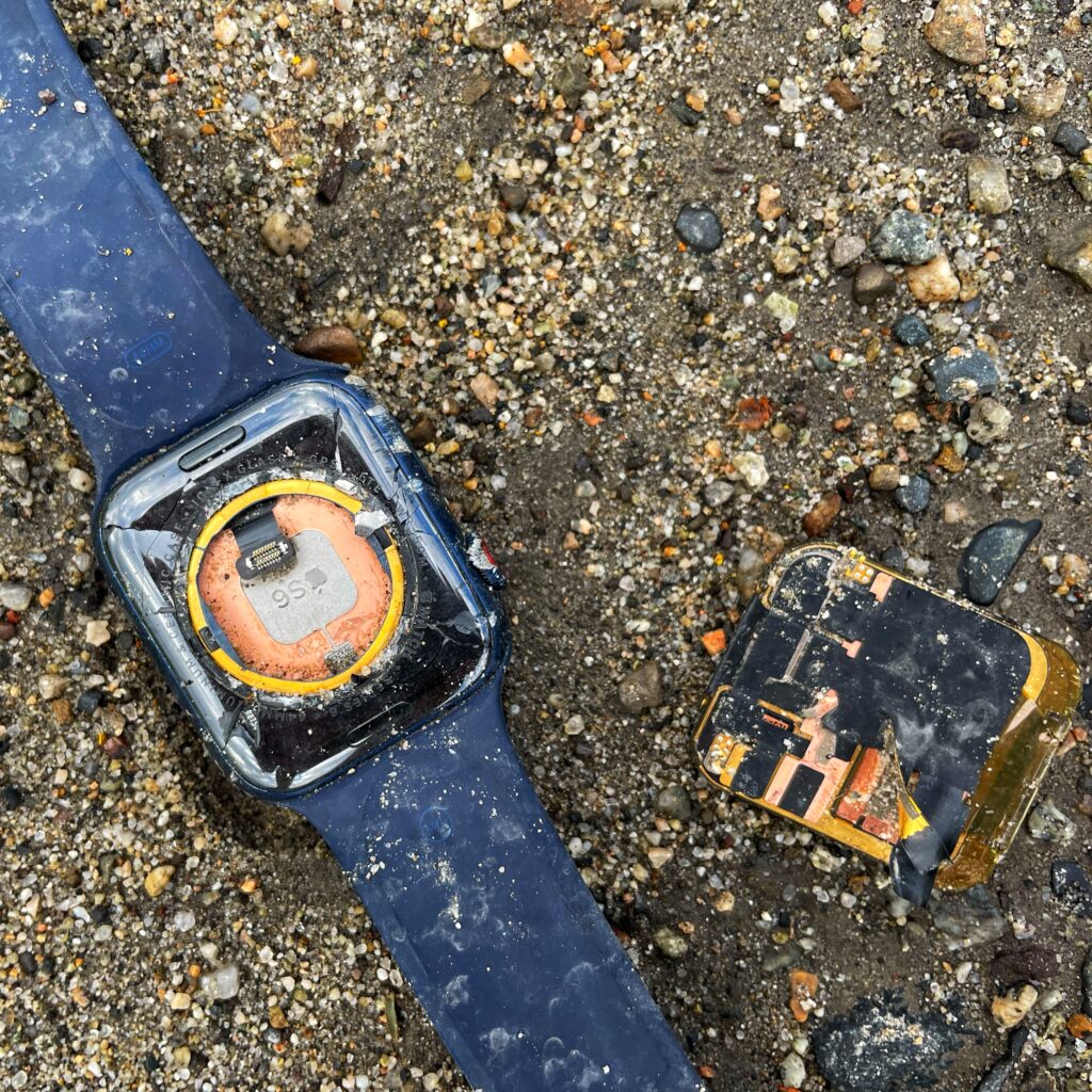 Low-waste living means tackling things like e-waste. This photo depicts a smashed Apple Watch.